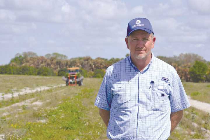 Tommy Todd, general manager of the Basinger grove for Lykes Bros. says its amazing to watch the company's converted pine tree planter turned citrus tree planter work. Photo by Frank Giles